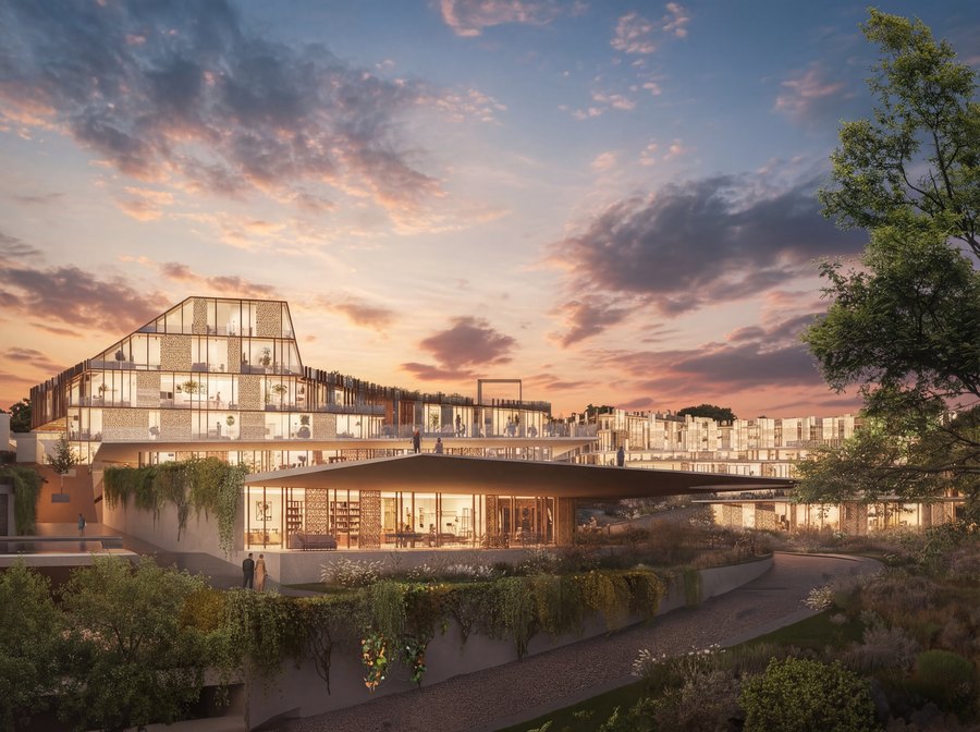 A wellness and services building at Mira Verde at sunset